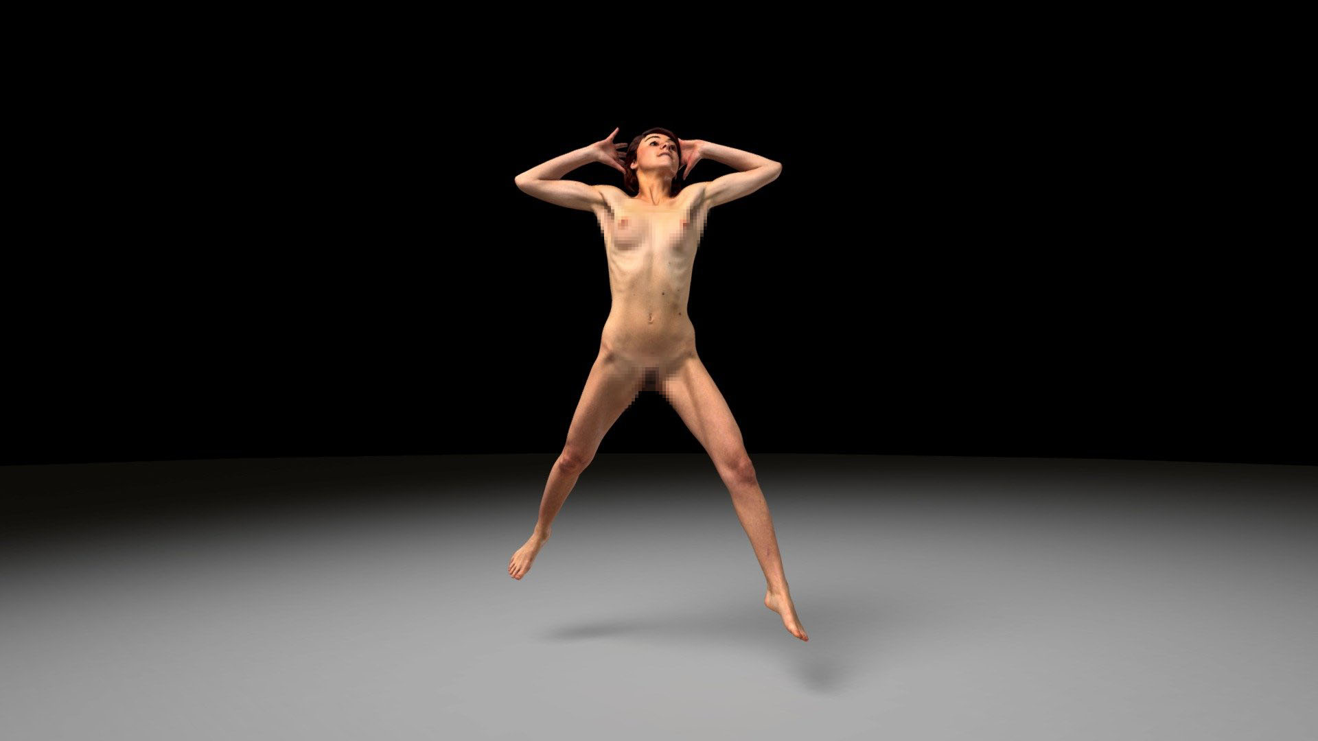 danae model freezed during a nude jump in the photostudio